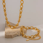 Gold-Tone Rolo Link Chain Necklace and Bracelet Set on stone