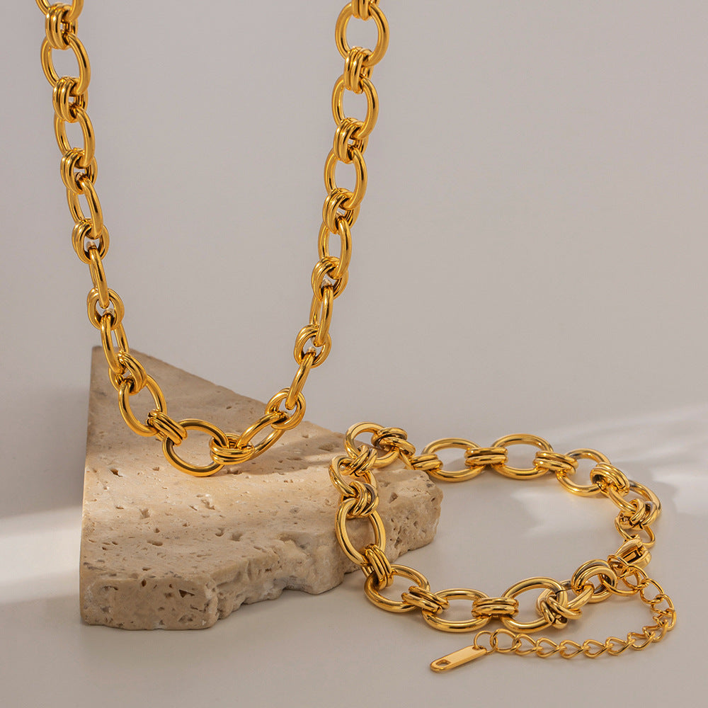 Gold-Tone Rolo Link Chain Necklace and Bracelet Set on stone
