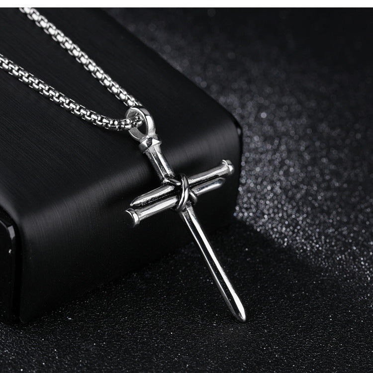 Nail Cross Pendant Necklace in black, gold-tone, and silver-tone view 4
