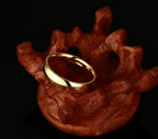 Gold-Tone Domed Stainless Steel Band Ring on black surface view 3