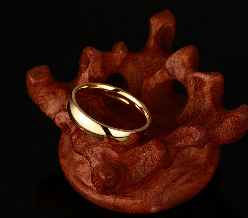 Gold-Tone Domed Stainless Steel Band Ring on black surface view 3