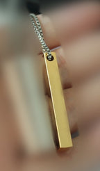 Titanium Steel Rectangular Bar Pendant on hand view 6