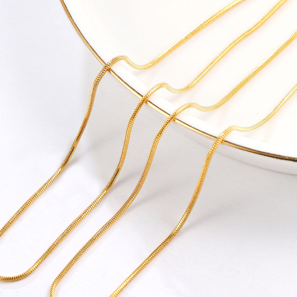 Gold-Tone Stainless Steel Snake Chain on dark background view 4