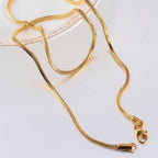 Gold-Tone Stainless Steel Snake Chain on dark background view 2