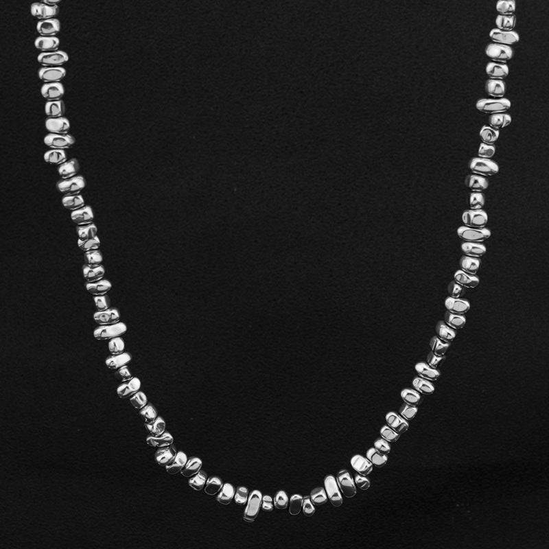 5mm Irregular Bead Stainless Steel Chain, silver finish, black background view 2