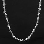 5mm Irregular Bead Stainless Steel Chain, silver finish, black background view 2