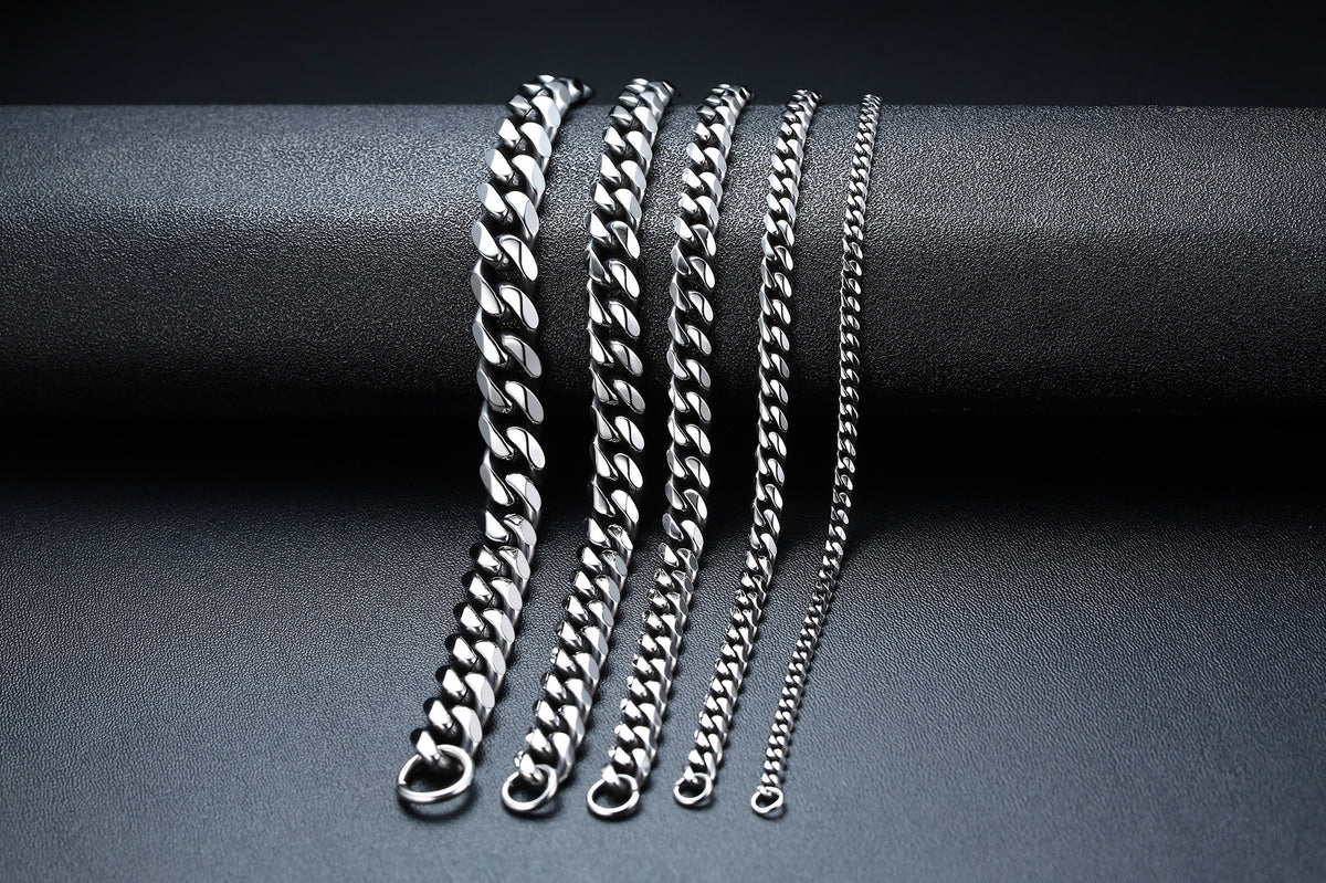Titanium Steel Cuban Link Bracelet in silver-tone and black finishes