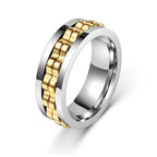 Stainless Steel Textured Spinner Ring with a gold-tone inner band