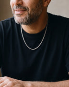 Close-up of the 4 mm Atlas Byzantine chain on a man's neck, true size
