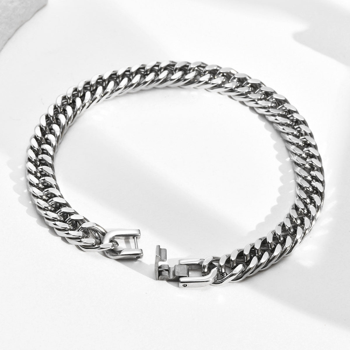 8mm Stainless Steel Curb Link Bracelet closed on wood background view 2