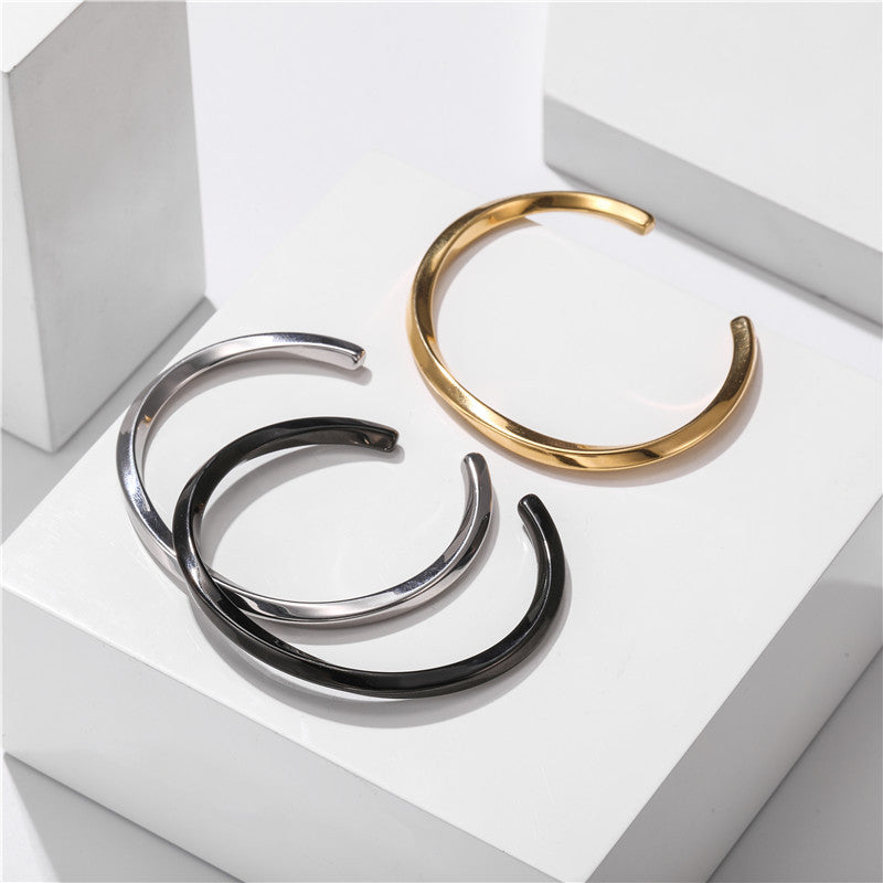 Titanium Steel C-Shaped Cuff Bracelet in gold, silver, and black finishes view 2
