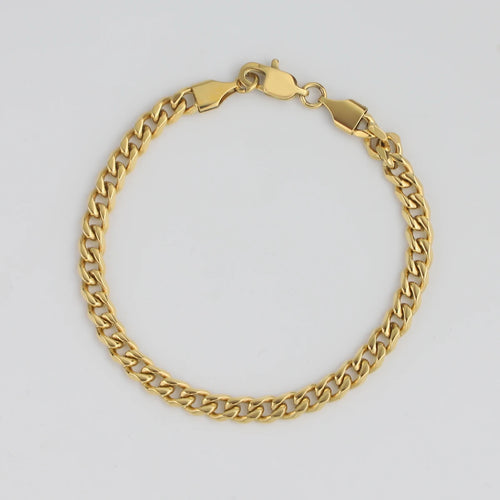 Polished gold Cuban link bracelet for men with a secure lobster clasp closure
