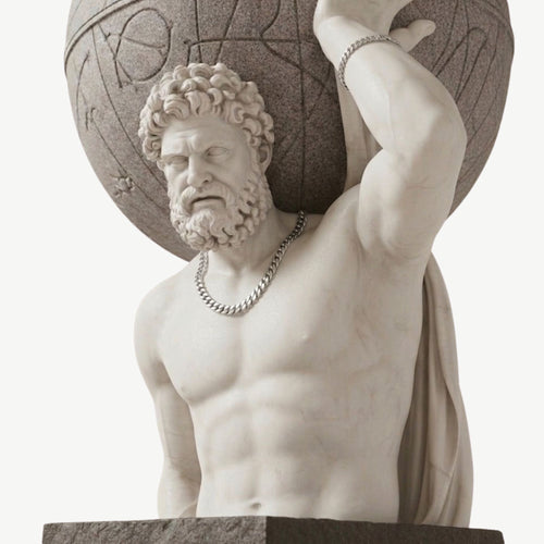 Statue of a bearded man holding a spherical object on his shoulders against a white background