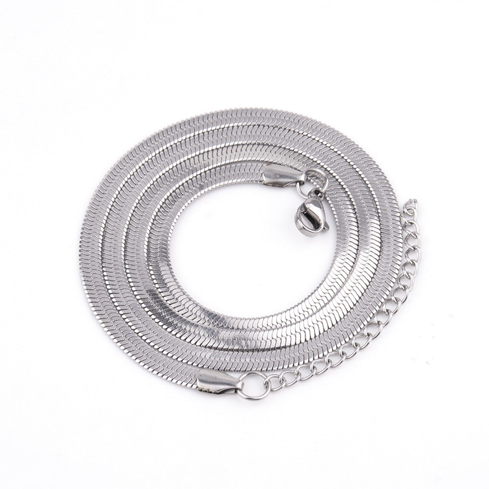 5mm Snake Chain Necklace in gold-tone stainless steel, coiled on a white background view 3