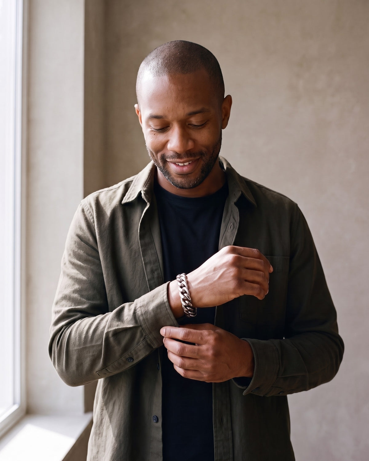 Man wearing the silver Atlas 11mm Silver Cuban Link Bracelet