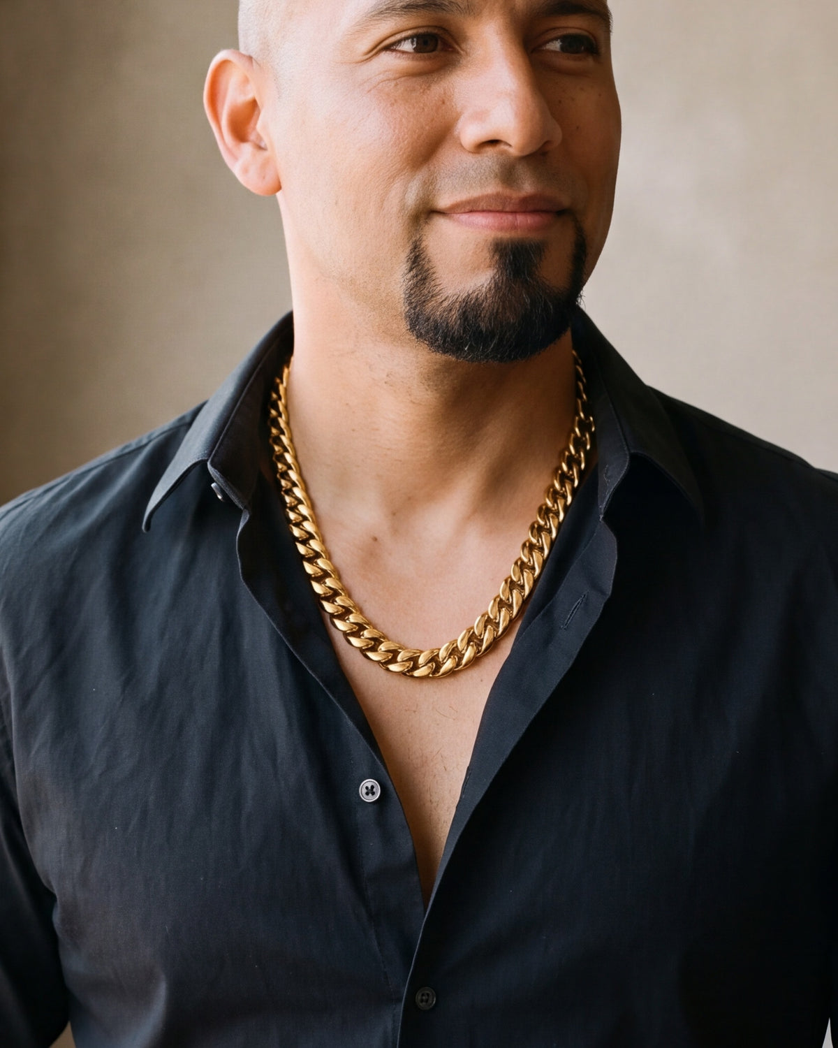 Close-up of the Atlas 14 mm Cuban chain in gold-tone steel, worn at true size