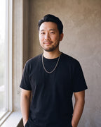 Man wearing the silver Atlas 2mm Rolo Link Chain in Stainless Steel
