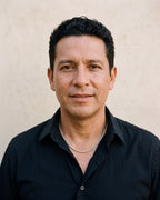 Man in an open-collar black shirt wearing the silver Atlas 3 mm wheat chain