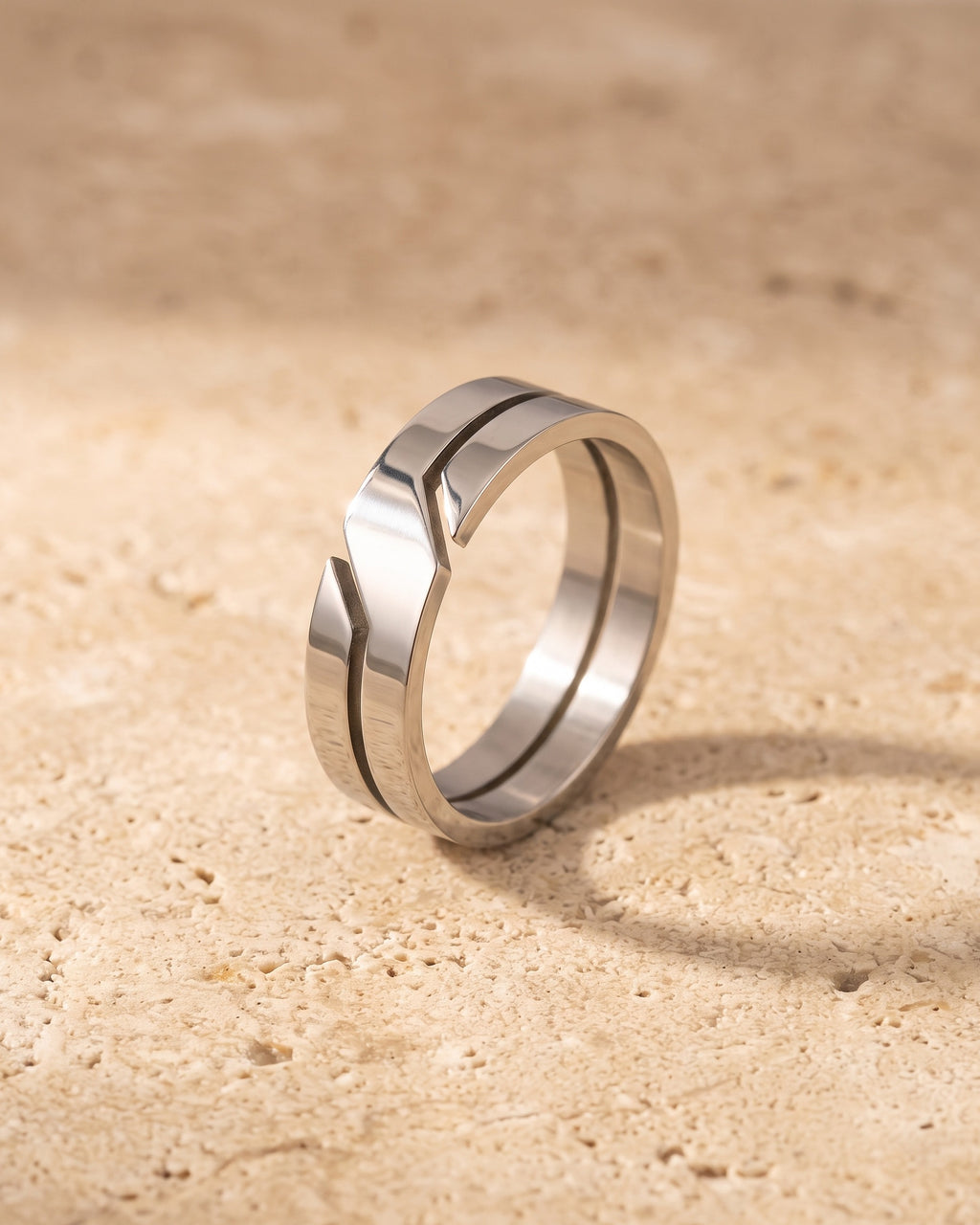 The whole silver-tone Atlas 6 mm geometric cut-out ring laid on warm stone