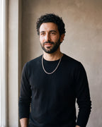 Man in a black merino sweater wearing the silver Atlas rope chain
