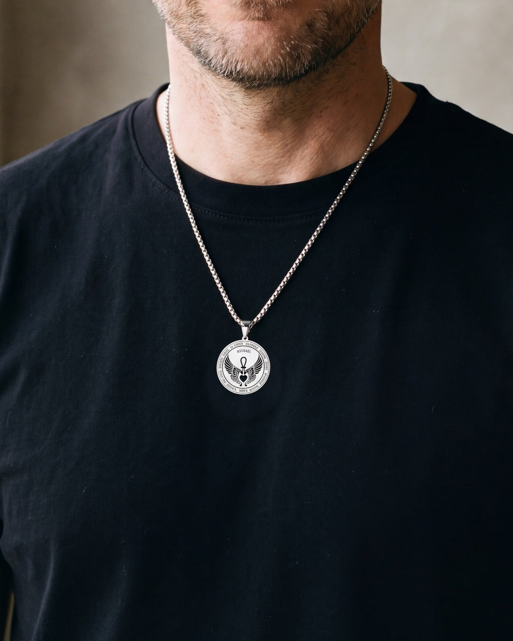 Close-up of the silver-tone Atlas Archangel Michael ankh pendant necklace worn, true size