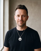 Man in a black T-shirt wearing the silver-tone Atlas Archangel Michael ankh pendant necklace