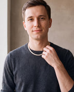 Man wearing the gold-tone Atlas Baguette Tennis Chain