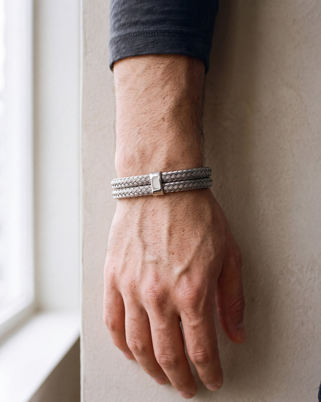 Close-up of the silver-tone Atlas Braided Magnetic Bracelet worn at true size