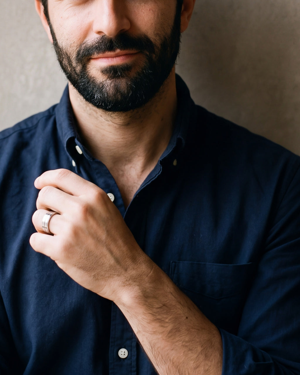 Close-up of the silver-tone Atlas double groove ring on a man's hand