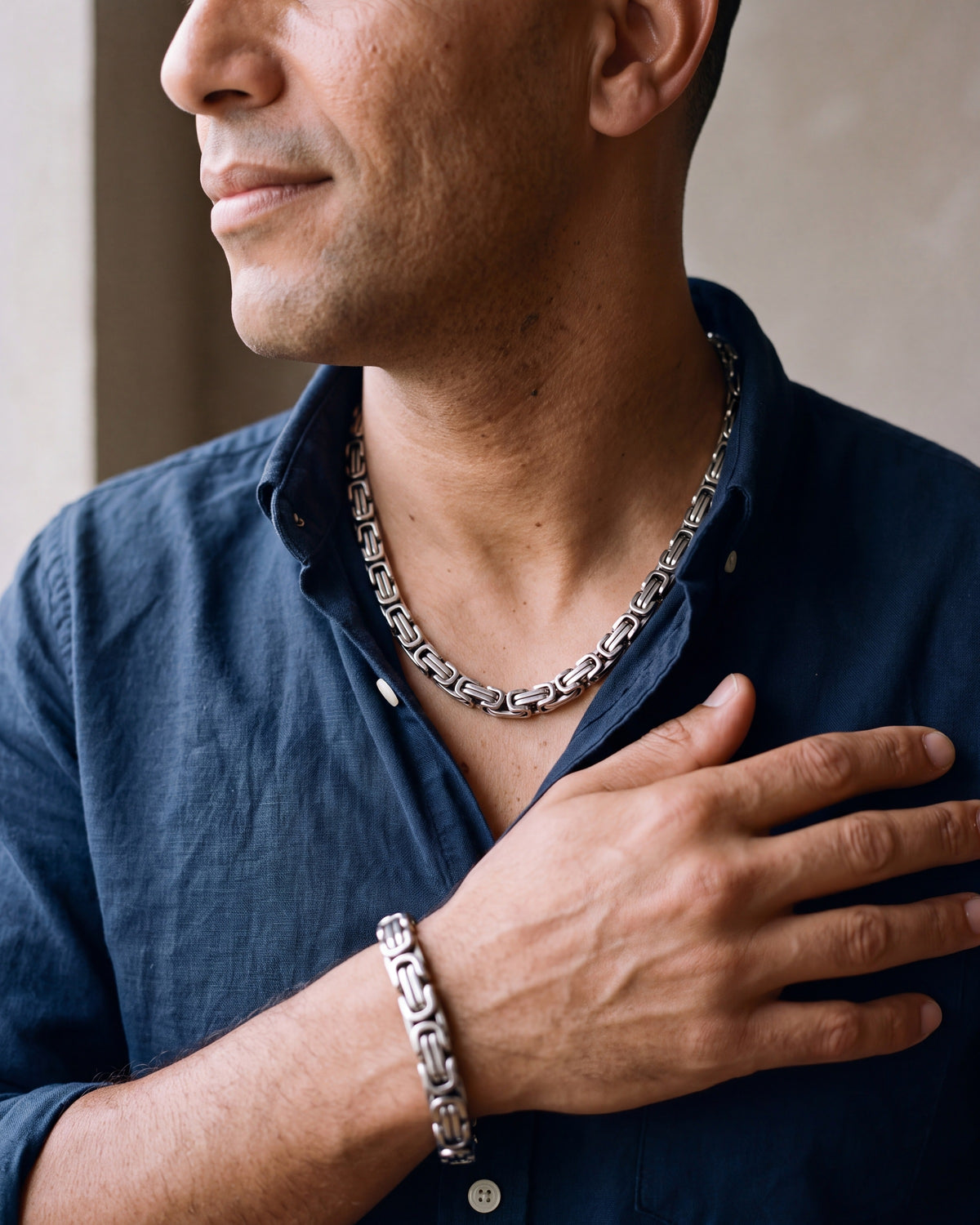 Close-up of the silver Atlas byzantine chain and bracelet set worn at true size