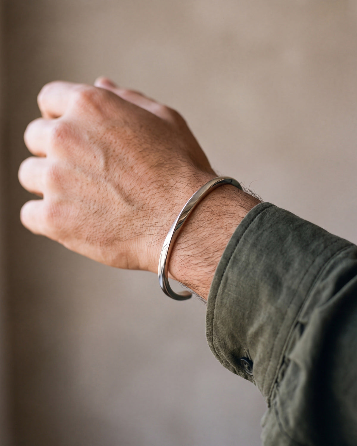Close-up of the silver-tone Atlas C-Shaped Cuff Bracelet worn at true size