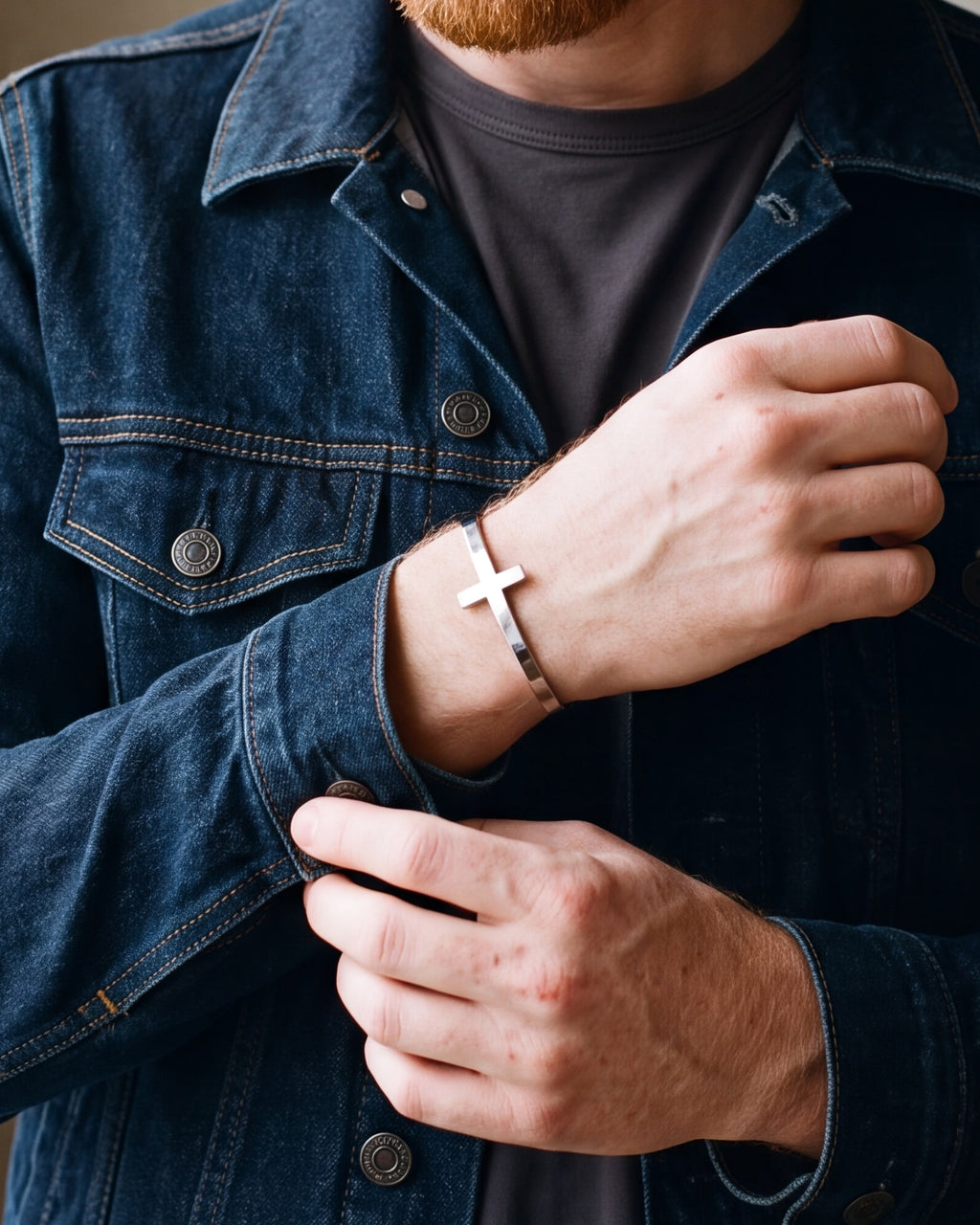 Close-up of the silver Atlas cross cuff on a man's wrist