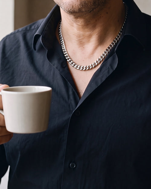 Close-up of the silver Atlas Cuban Chain in Stainless Steel worn by a man, shown at true size