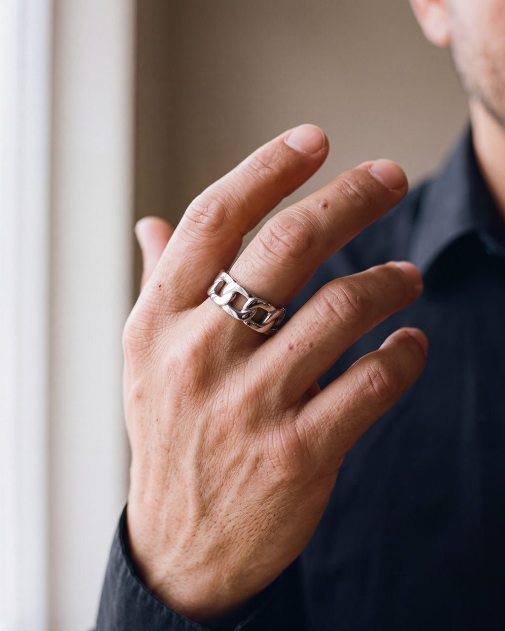 Close-up of the silver-tone Atlas Cuban Chain Ring worn at true size