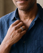 Close-up of the Atlas Cuban link band ring in silver-tone steel, worn at true size