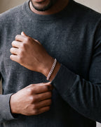 Close-up of the Atlas Cuban link bracelet in silver-tone steel, worn at true size