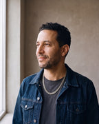 Man wearing the silver Atlas Cuban Link Chain in Stainless Steel