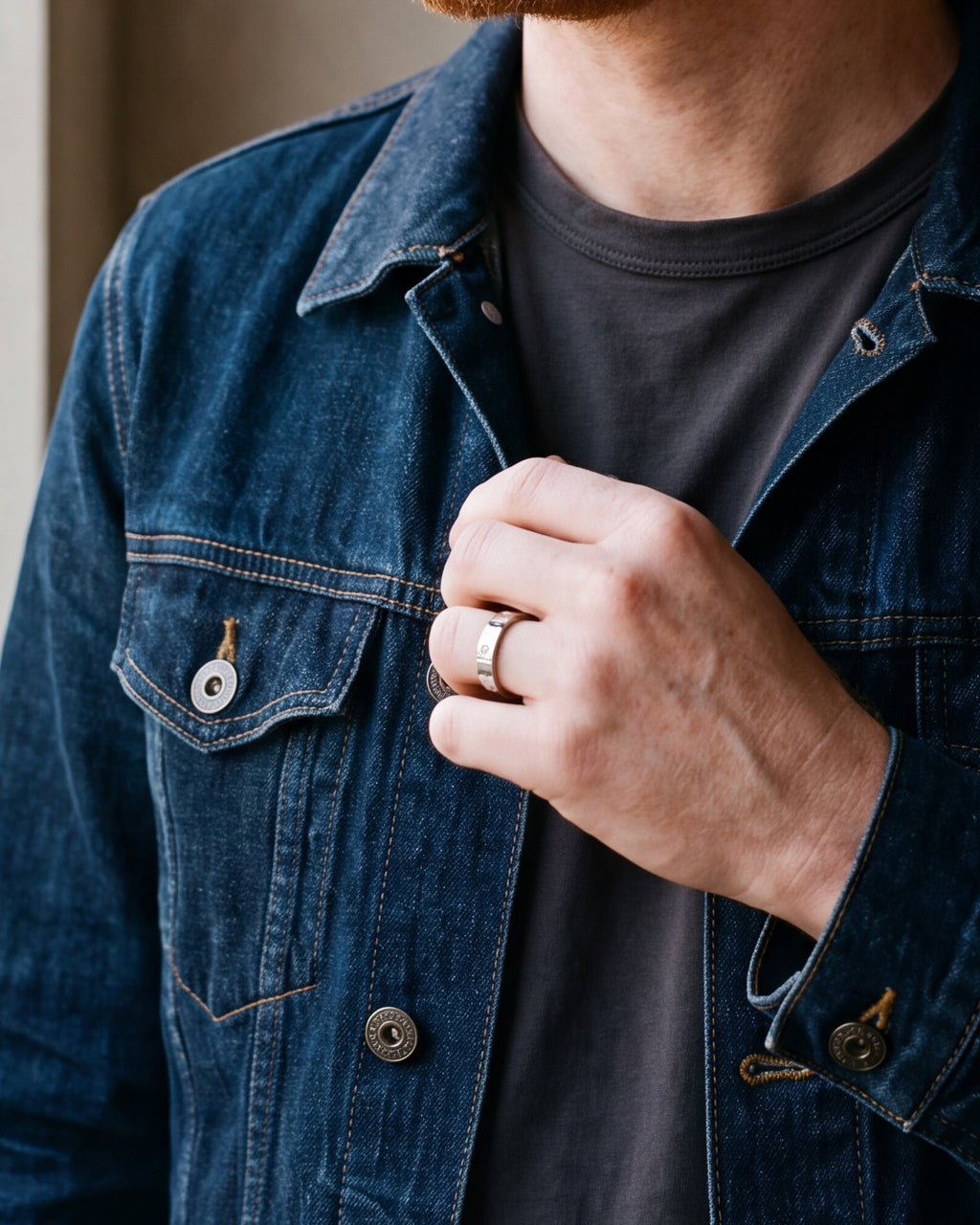 Close-up of a man's hand wearing the Atlas cubic zirconia band ring at true size