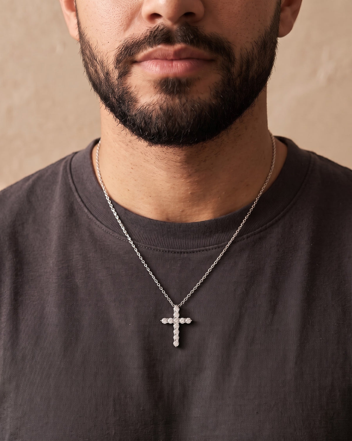 Close-up of the silver Atlas CZ Cross Necklace in Titanium Steel worn by a man, shown at true size