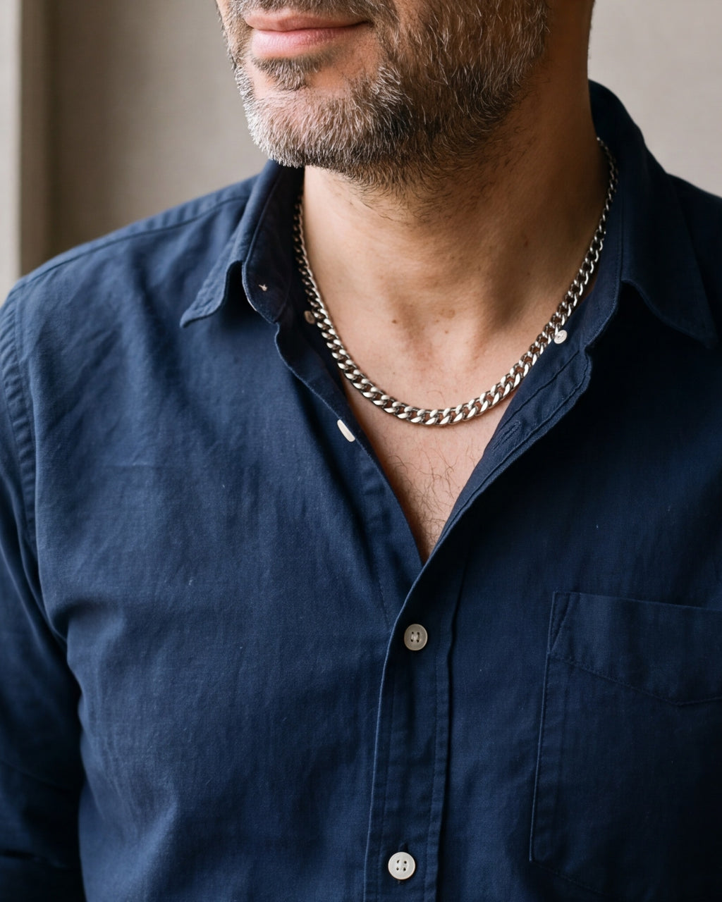 Close-up of the Atlas dense Cuban chain in silver-tone steel, worn at true size
