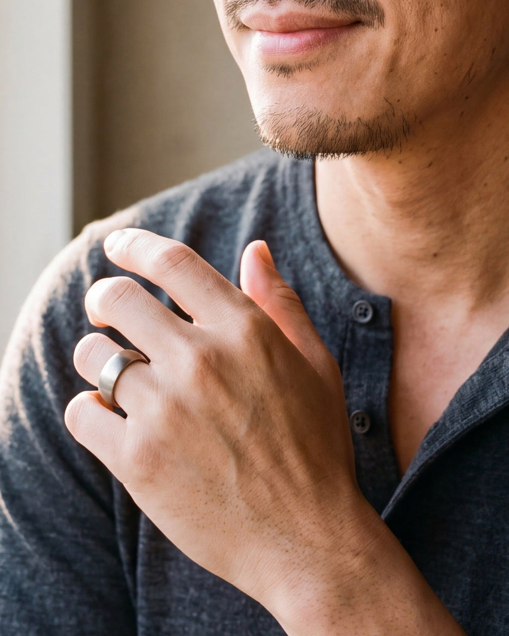 Close-up of the silver-tone Atlas domed brushed tungsten ring worn, true size