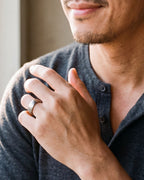 Close-up of the silver-tone Atlas domed brushed tungsten ring worn, true size