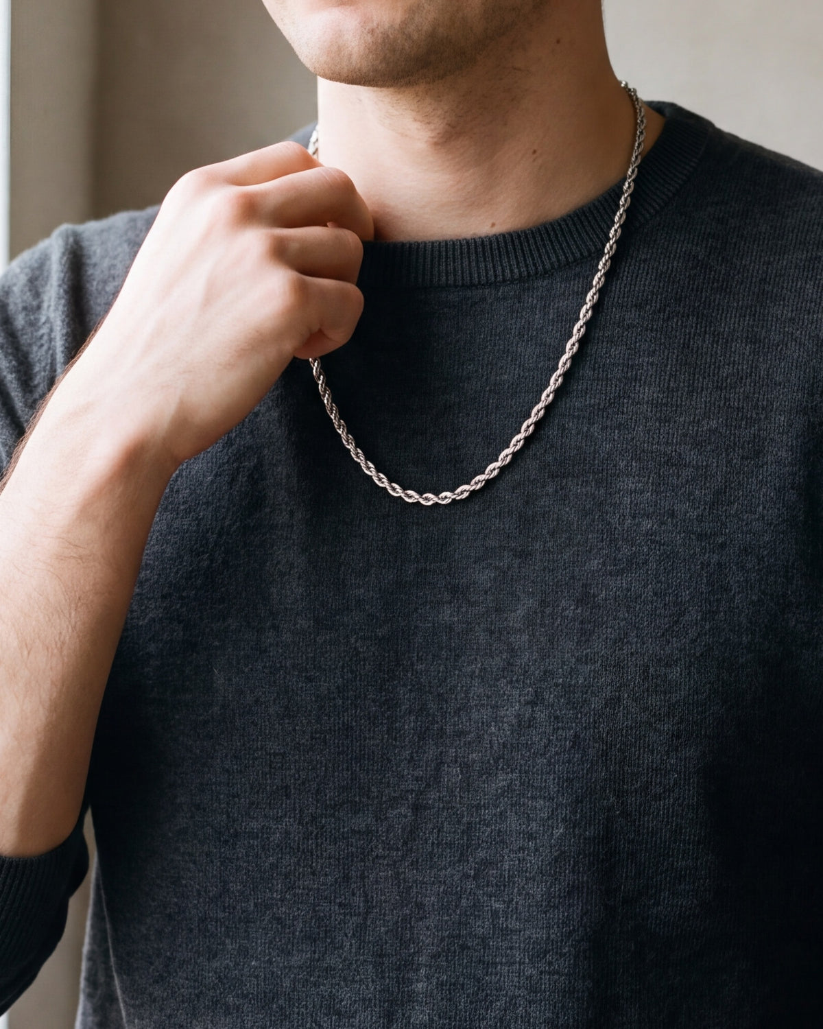 Close-up of the 4 mm silver Atlas rope chain on a man's neck at true size