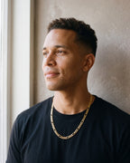 Second man in a plain heavyweight black cotton crew-neck t-shirt (thick wearing the gold-tone Atlas figaro chain