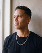 Man wearing the silver Atlas Figaro Chain in 304 Stainless Steel