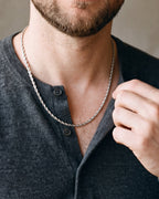 Close-up of the silver Atlas fine rope chain worn at true size