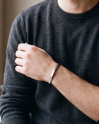 Close-up of the silver Atlas flat cuff on a man's wrist