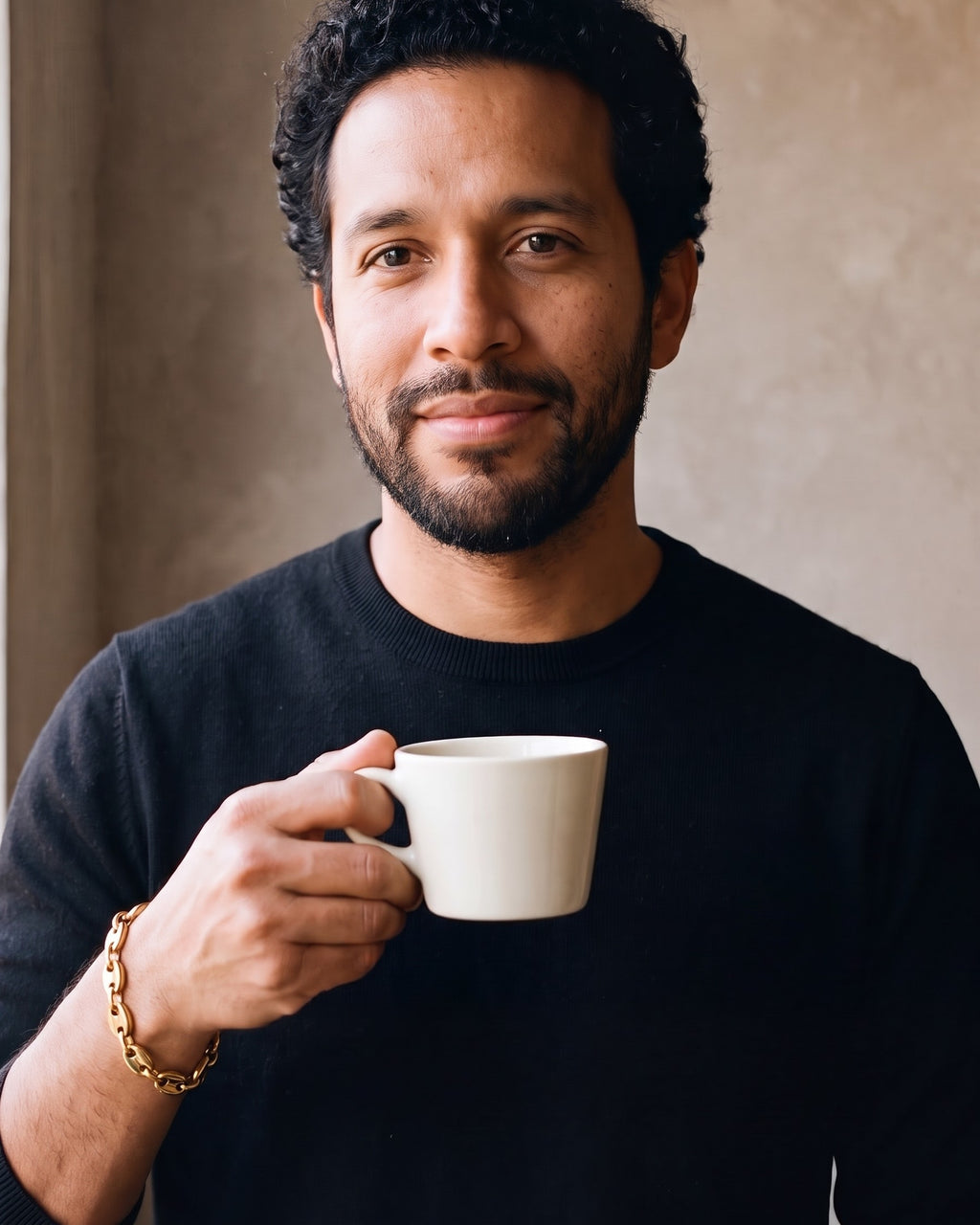 Man wearing the gold-tone Atlas Gold-Tone Coffee Bean Link Bracelet