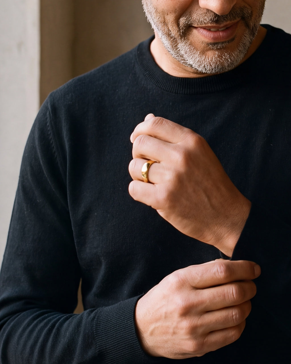 Close-up of the Atlas polished dome band in gold-tone steel, worn at true size