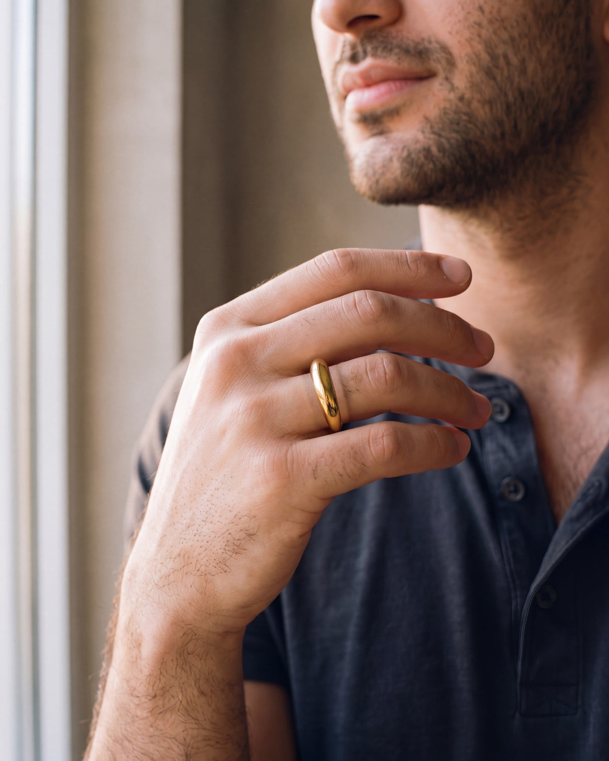 Close-up of the gold-tone Atlas Gold-Tone Tapered Dome Ring worn, true size